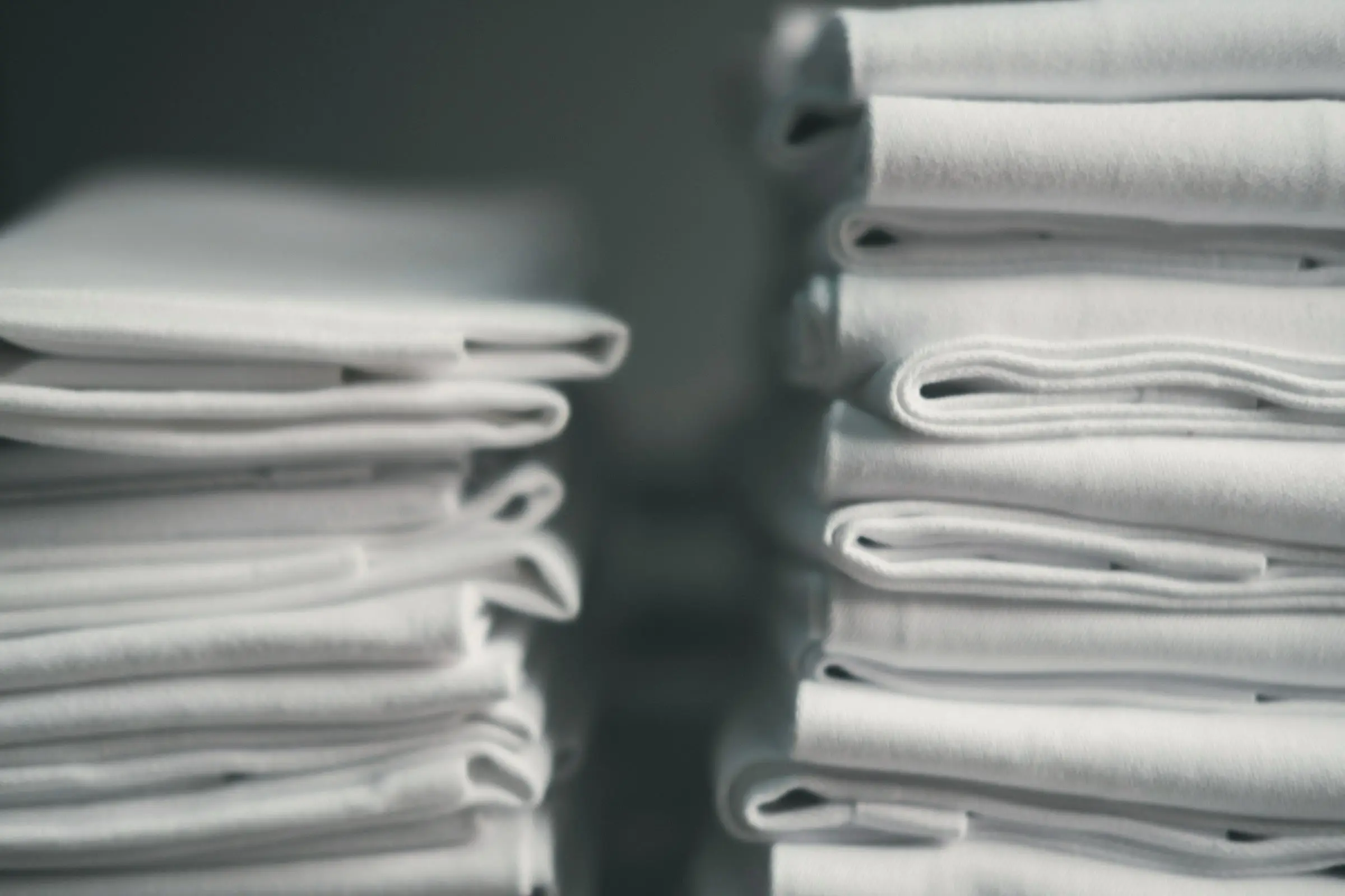 Neat stacks of folded white linen